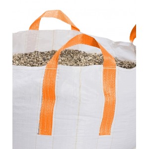 The side of a white mini big bag filled with gravel.