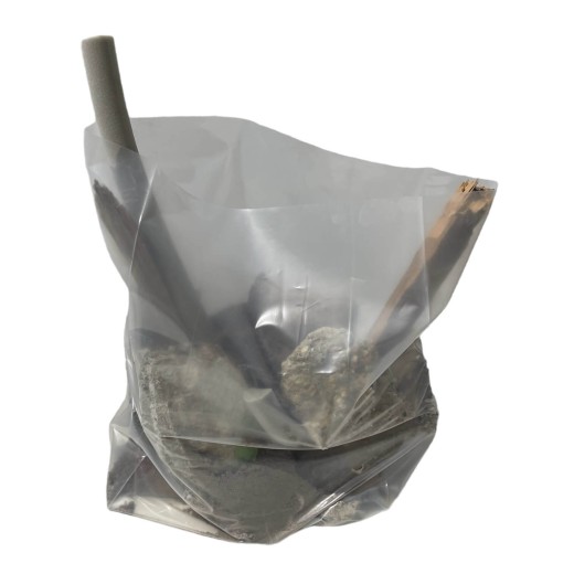 Filled transparent rubble bag with waste in it
