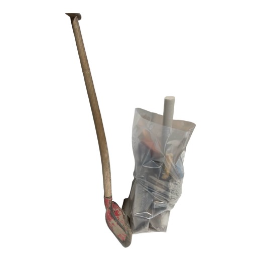 Large transparent rubble bag with a shovel